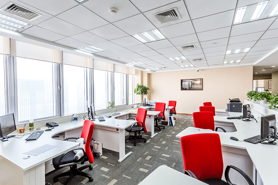 Bright open-plan office with red chairs and ceiling-mounted air conditioning, showing a comfortable indoor environment powered by a Mitsubishi Electric multi split system air conditioner unit.
