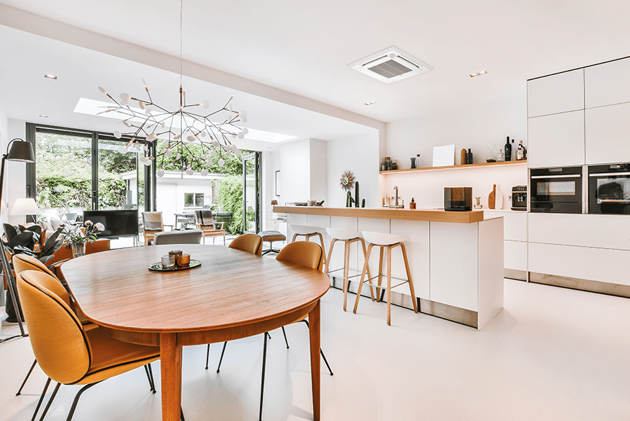 Modern kitchen with a Mitsubishi Electric PLA-M-EA ceiling cassette air conditioner providing balanced comfort through wide and horizontal airflow