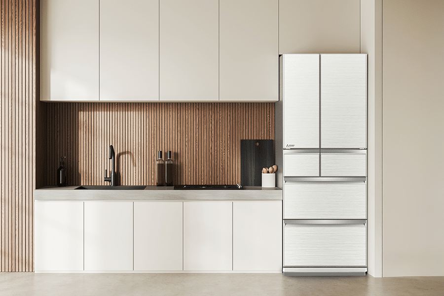 Mitsubishi Electric MR-WX470F-W-A multi drawer fridge in white, styled in a modern kitchen with wood panel feature wall and minimalist cabinetry.
