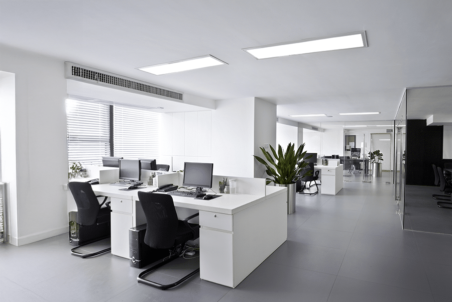 Modern open-plan office with Mitsubishi Electric bulkhead air conditioning showing CITY MULTI indoor unit compatibility and control options