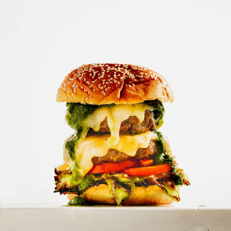 ROASTED GARLIC BEEF BURGER WITH GARDEN HERBS AND GRILLED CABBAGE