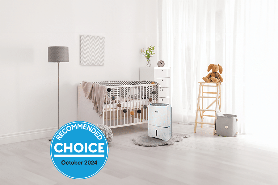 Mitsubishi Electric 38-litre dehumidifier placed in a nursery, with a CHOICE Recommended badge for October 2024, highlighting its suitability for families and moisture-heavy areas.
